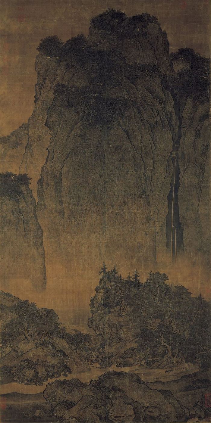 Monumental Chinese mountain landscape with a waterfall and travellers
